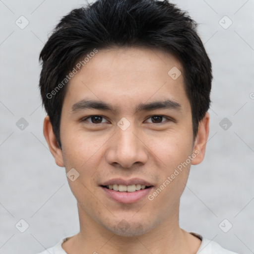 Joyful white young-adult male with short  black hair and brown eyes