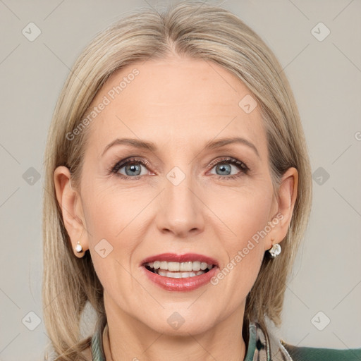 Joyful white adult female with medium  brown hair and blue eyes