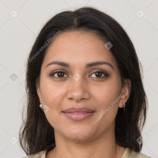 Joyful latino young-adult female with medium  brown hair and brown eyes