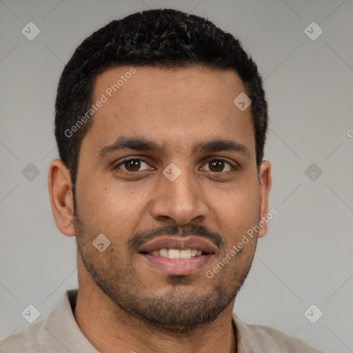 Joyful black young-adult male with short  brown hair and brown eyes