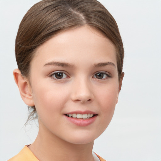 Joyful white child female with short  brown hair and brown eyes