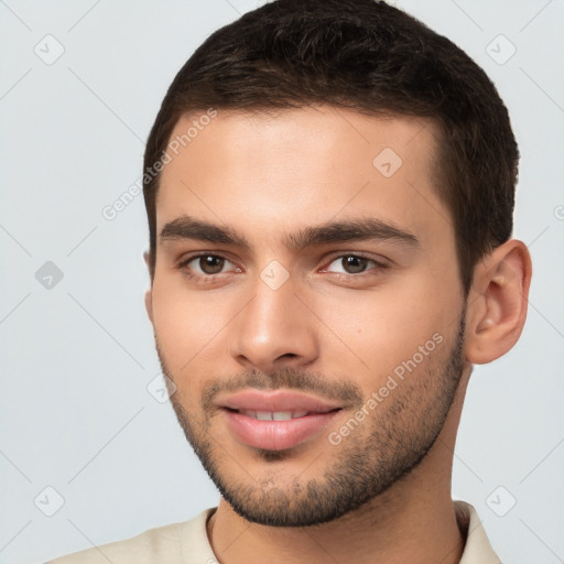 Joyful white young-adult male with short  brown hair and brown eyes