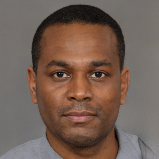 Neutral black young-adult male with short  brown hair and brown eyes