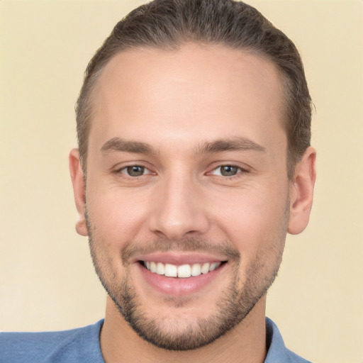 Joyful white young-adult male with short  brown hair and brown eyes