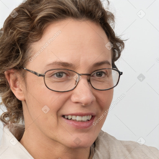 Joyful white adult female with medium  brown hair and blue eyes