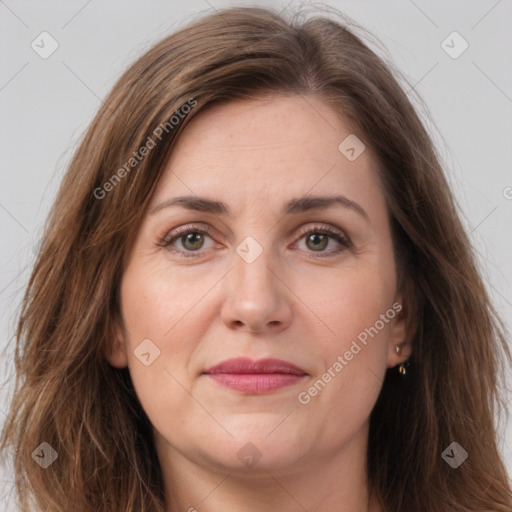 Joyful white adult female with long  brown hair and brown eyes