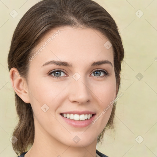 Joyful white young-adult female with medium  brown hair and green eyes