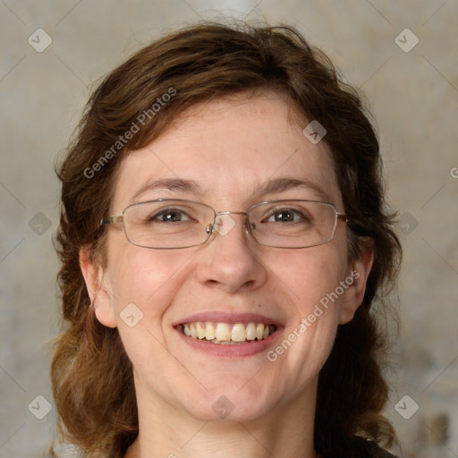 Joyful white adult female with medium  brown hair and blue eyes