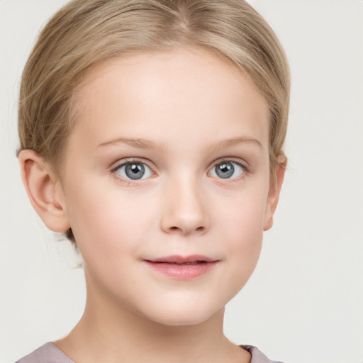 Joyful white child female with short  brown hair and grey eyes