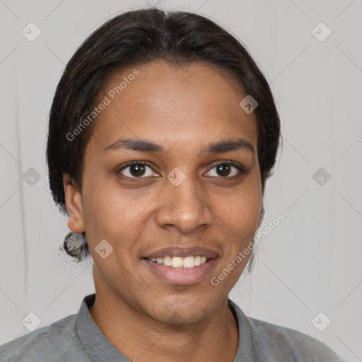 Joyful black young-adult female with short  brown hair and brown eyes