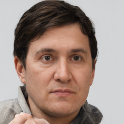 Neutral white adult male with short  brown hair and grey eyes