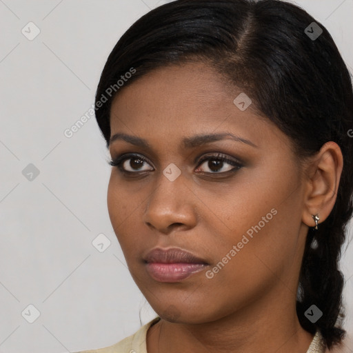 Neutral black young-adult female with medium  brown hair and brown eyes