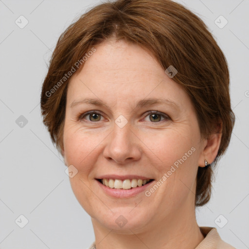 Joyful white adult female with short  brown hair and grey eyes