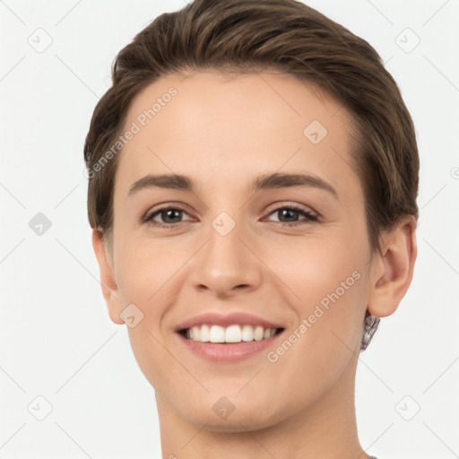 Joyful white young-adult female with short  brown hair and brown eyes