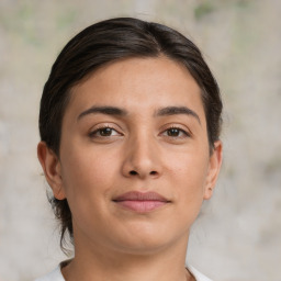 Joyful white young-adult female with medium  brown hair and brown eyes