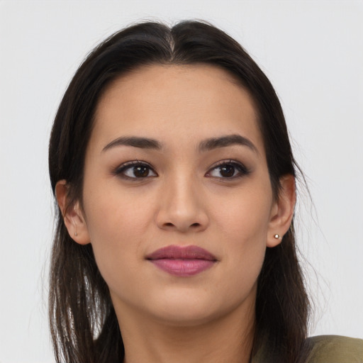 Joyful asian young-adult female with long  brown hair and brown eyes