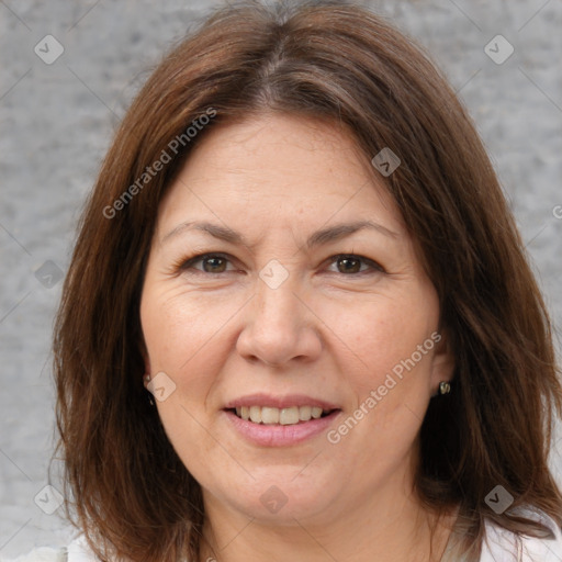 Joyful white adult female with medium  brown hair and brown eyes