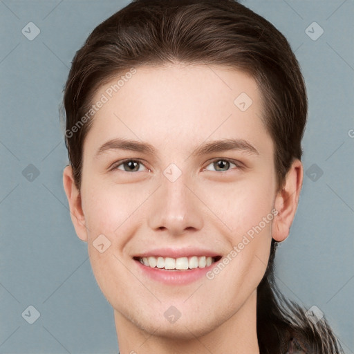 Joyful white young-adult female with short  brown hair and grey eyes