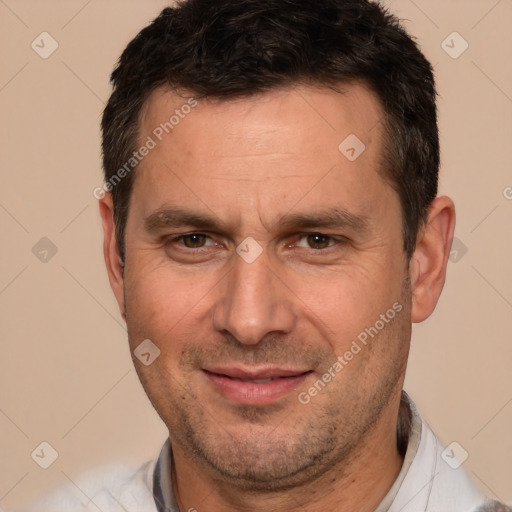 Joyful white adult male with short  brown hair and brown eyes