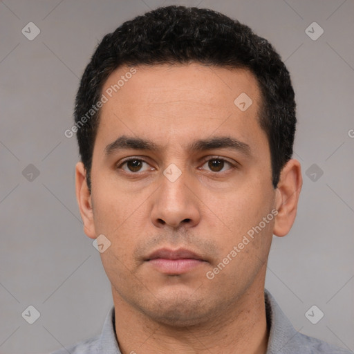 Neutral white young-adult male with short  black hair and brown eyes