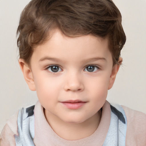 Joyful white child male with short  brown hair and grey eyes