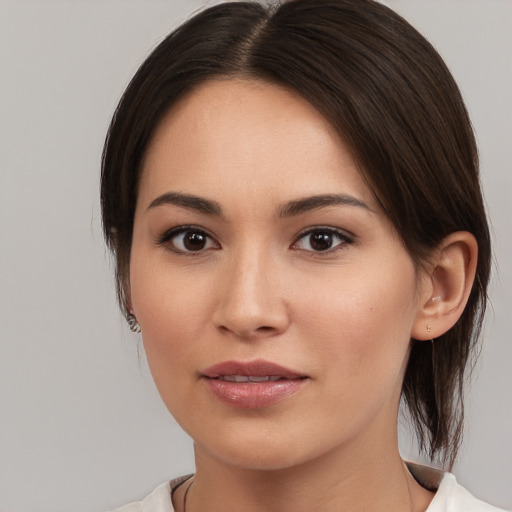 Joyful white young-adult female with medium  brown hair and brown eyes