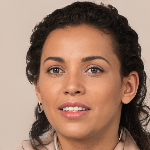 Joyful white young-adult female with medium  brown hair and brown eyes