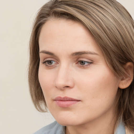 Neutral white young-adult female with medium  brown hair and grey eyes