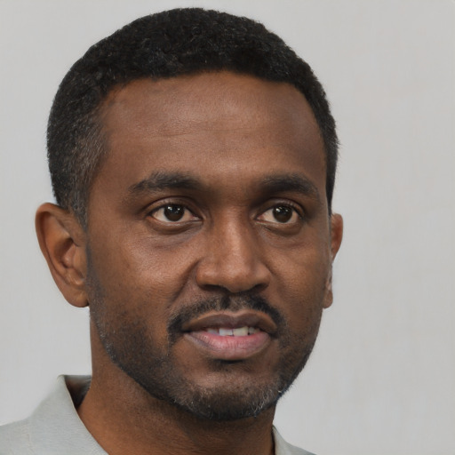 Neutral black young-adult male with short  black hair and brown eyes