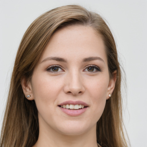 Joyful white young-adult female with long  brown hair and grey eyes