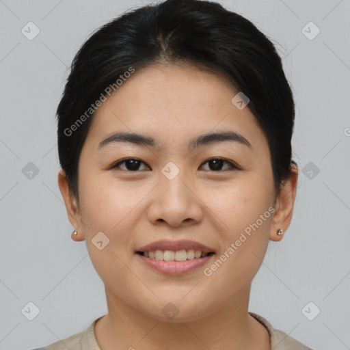 Joyful asian young-adult female with short  brown hair and brown eyes