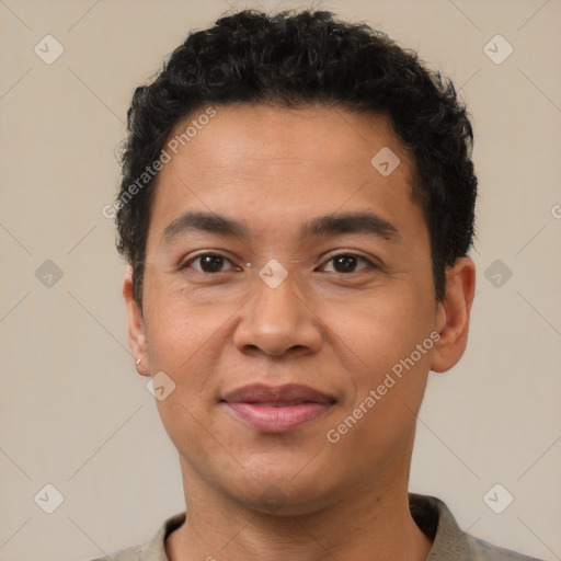 Joyful latino adult male with short  brown hair and brown eyes