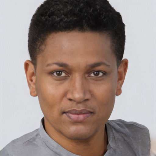 Joyful black young-adult male with short  brown hair and brown eyes
