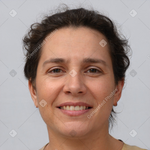 Joyful white adult female with short  brown hair and brown eyes