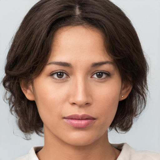 Neutral white young-adult female with medium  brown hair and brown eyes