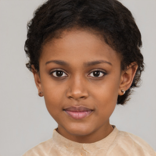 Joyful black child female with short  brown hair and brown eyes