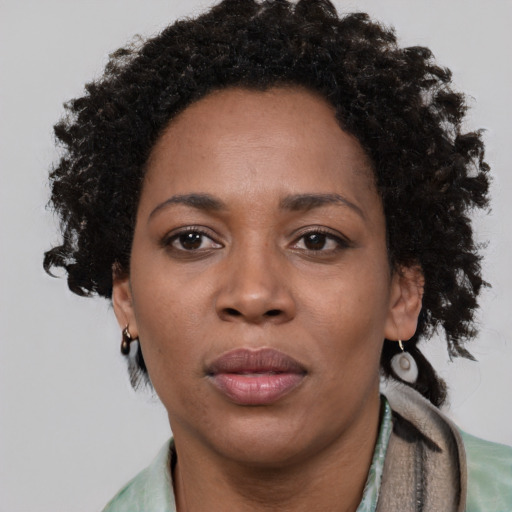 Neutral black adult female with short  brown hair and brown eyes