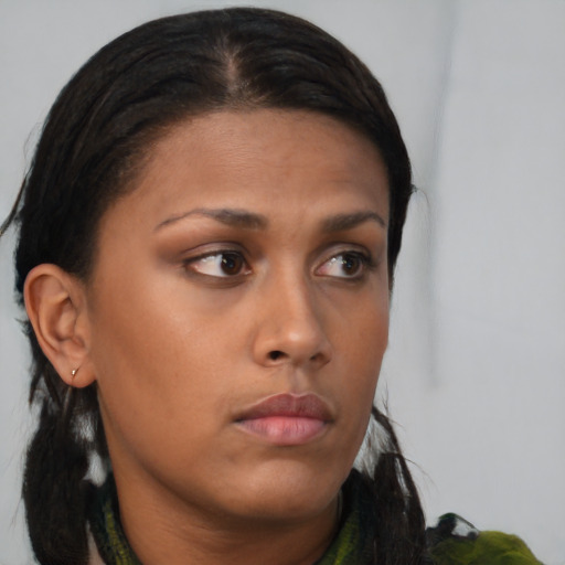 Neutral black young-adult female with medium  brown hair and brown eyes