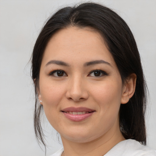 Joyful asian young-adult female with medium  brown hair and brown eyes