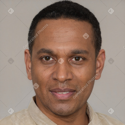 Joyful latino adult male with short  brown hair and brown eyes