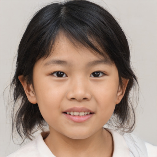 Joyful asian child female with medium  brown hair and brown eyes