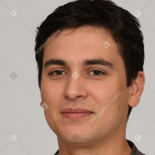 Joyful white young-adult male with short  black hair and brown eyes