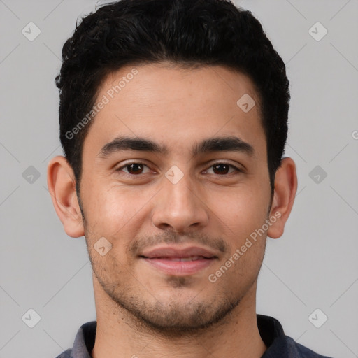 Joyful white young-adult male with short  black hair and brown eyes