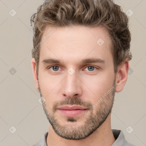 Neutral white young-adult male with short  brown hair and grey eyes