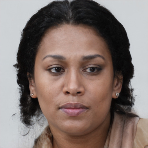 Neutral black young-adult female with medium  brown hair and brown eyes