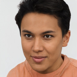 Joyful latino young-adult male with short  brown hair and brown eyes