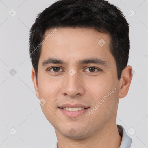 Joyful white young-adult male with short  black hair and brown eyes