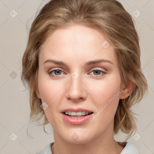 Joyful white young-adult female with medium  brown hair and blue eyes