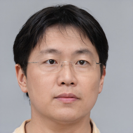 Neutral asian adult male with short  brown hair and brown eyes