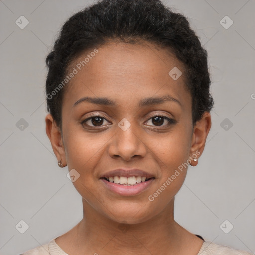 Joyful black young-adult female with short  brown hair and brown eyes